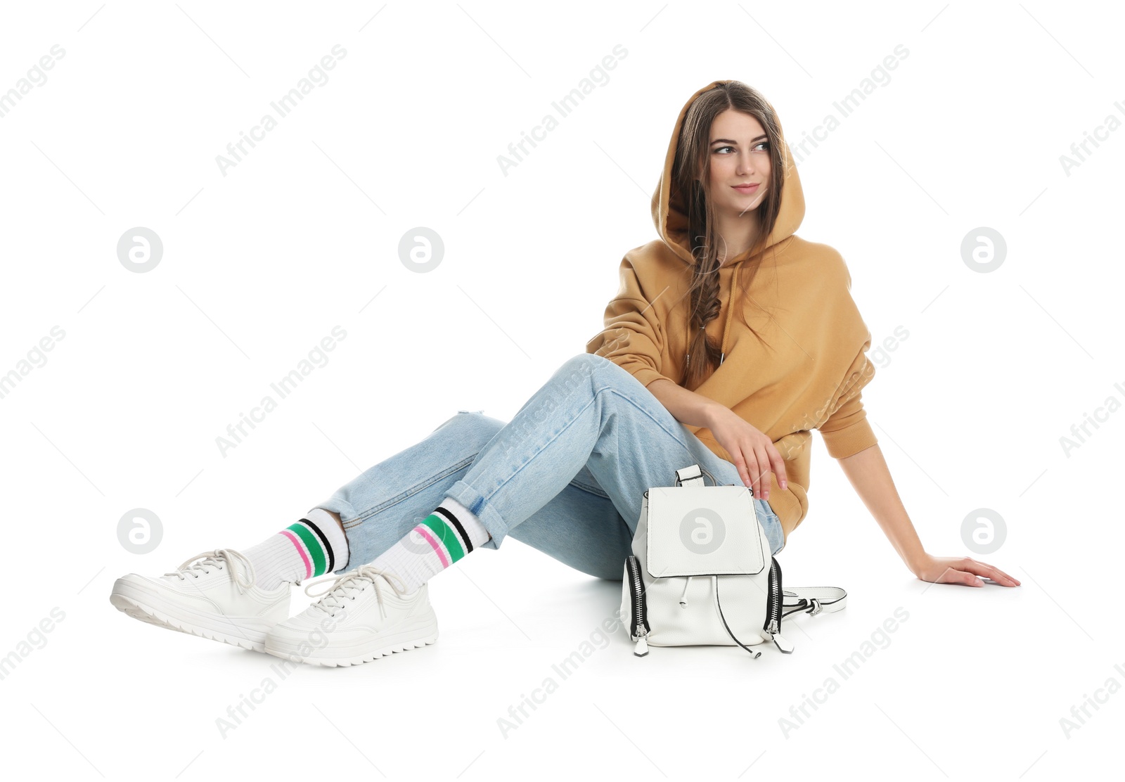 Photo of Beautiful young woman in casual outfit with stylish bag on white background