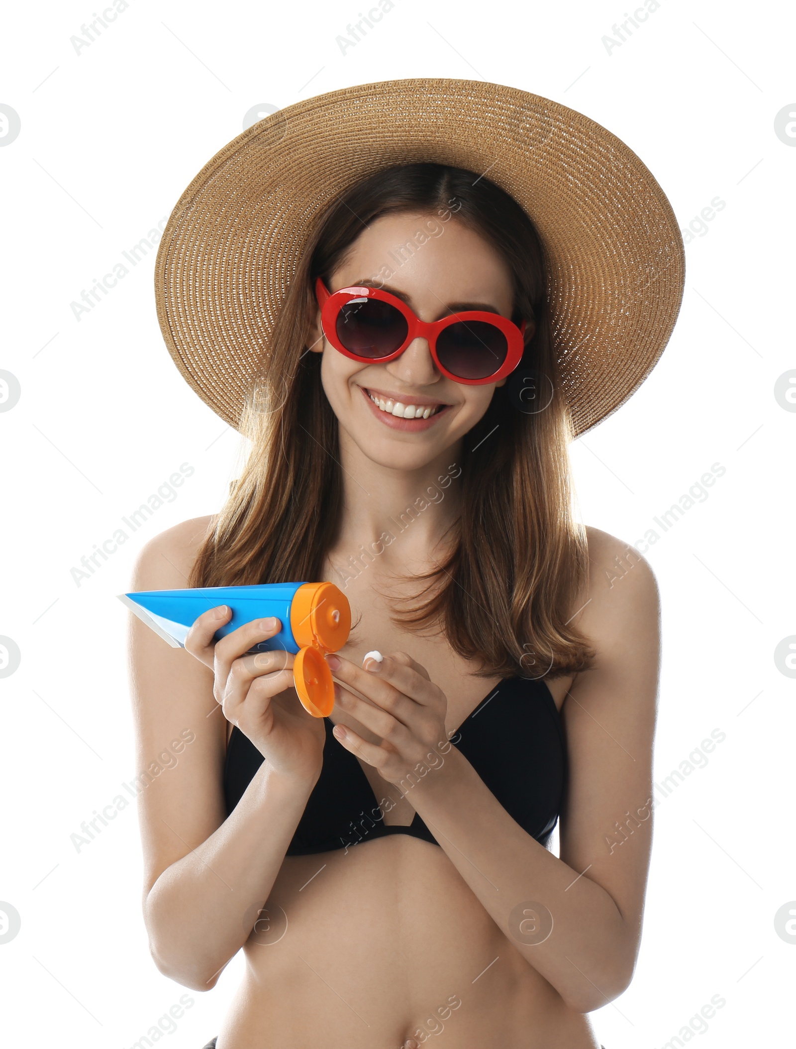 Photo of Young woman applying sun protection cream on white background