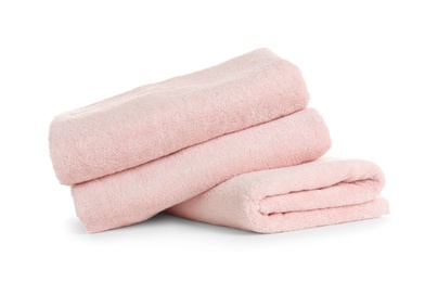 Stack of clean soft towels on white background