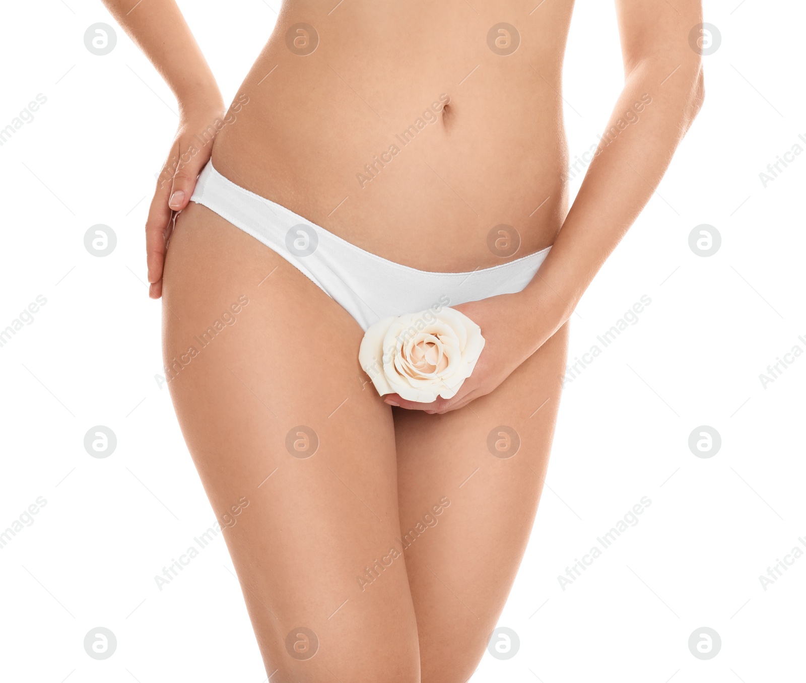 Photo of Woman with rose showing smooth skin on white background, closeup. Brazilian bikini epilation