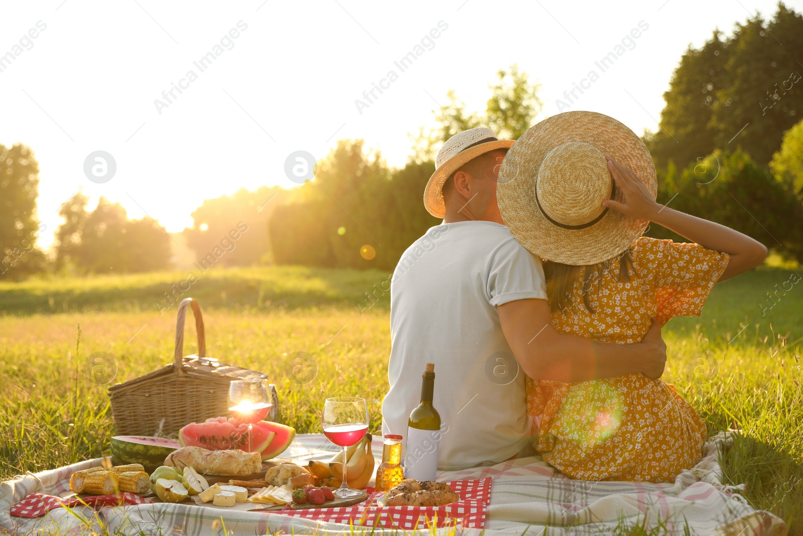 Photo of Happy couple having picnic in park on sunny day