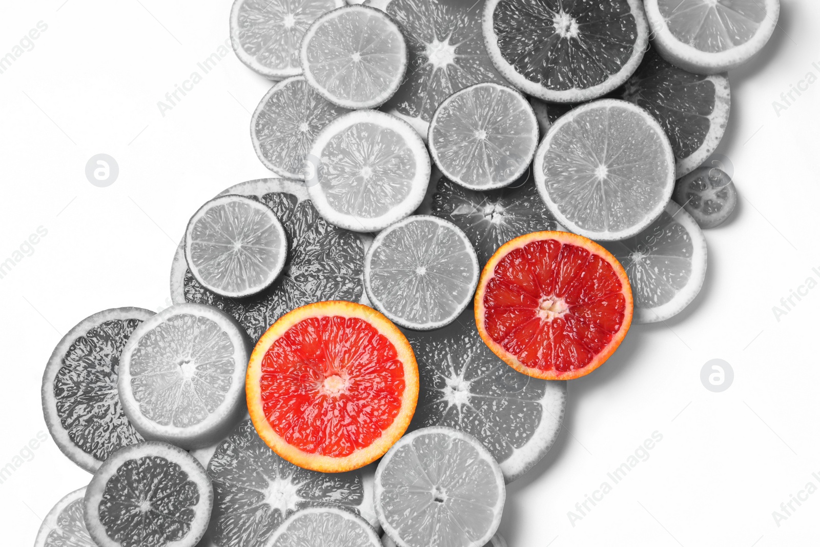 Image of Fresh citrus fruits on light background, flat lay. Black and white tone with selective color effect