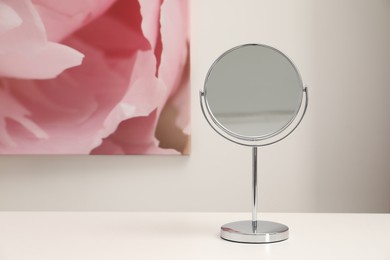 Mirror on white dressing table, space for text