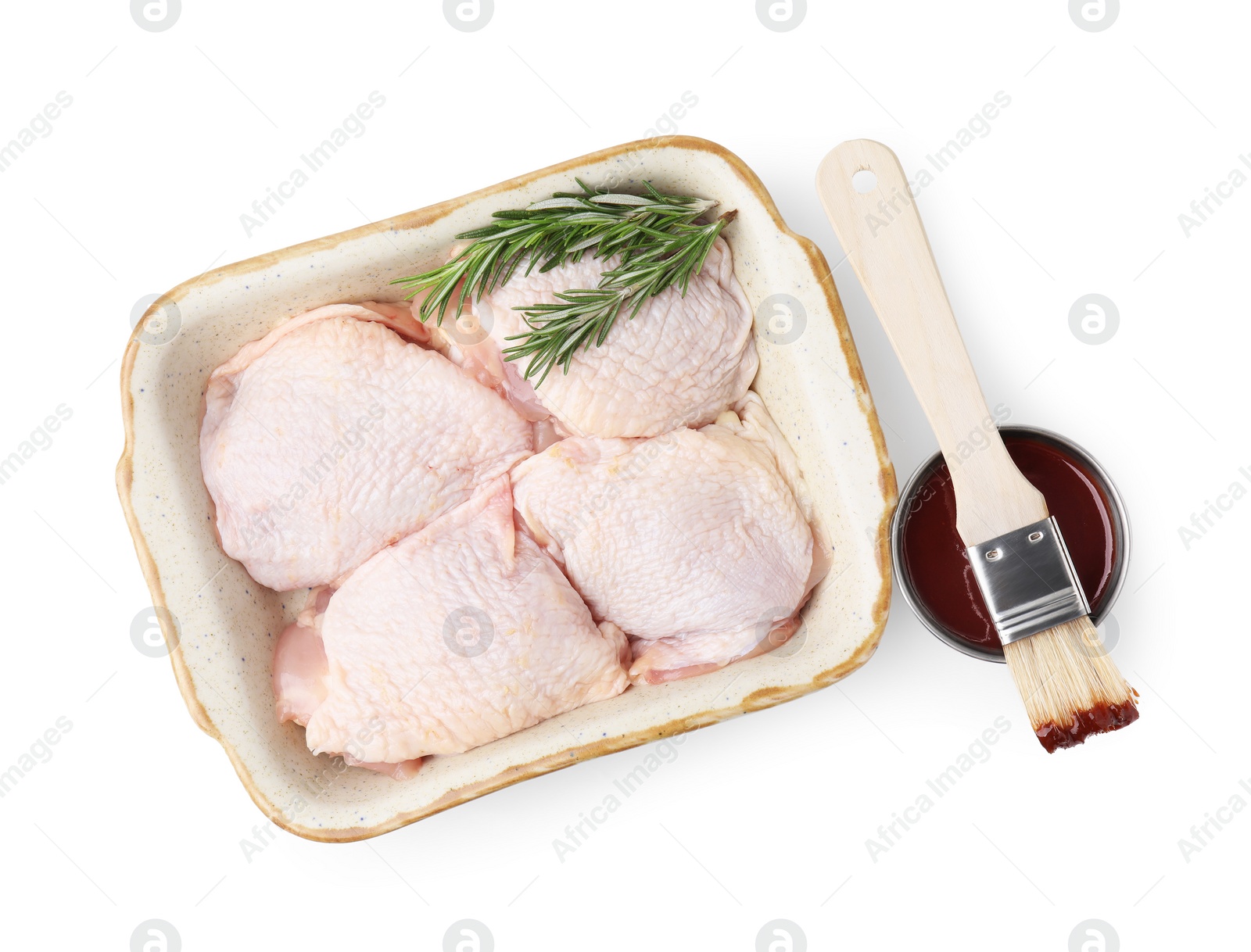 Photo of Marinade, basting brush, raw chicken and rosemary isolated on white, top view