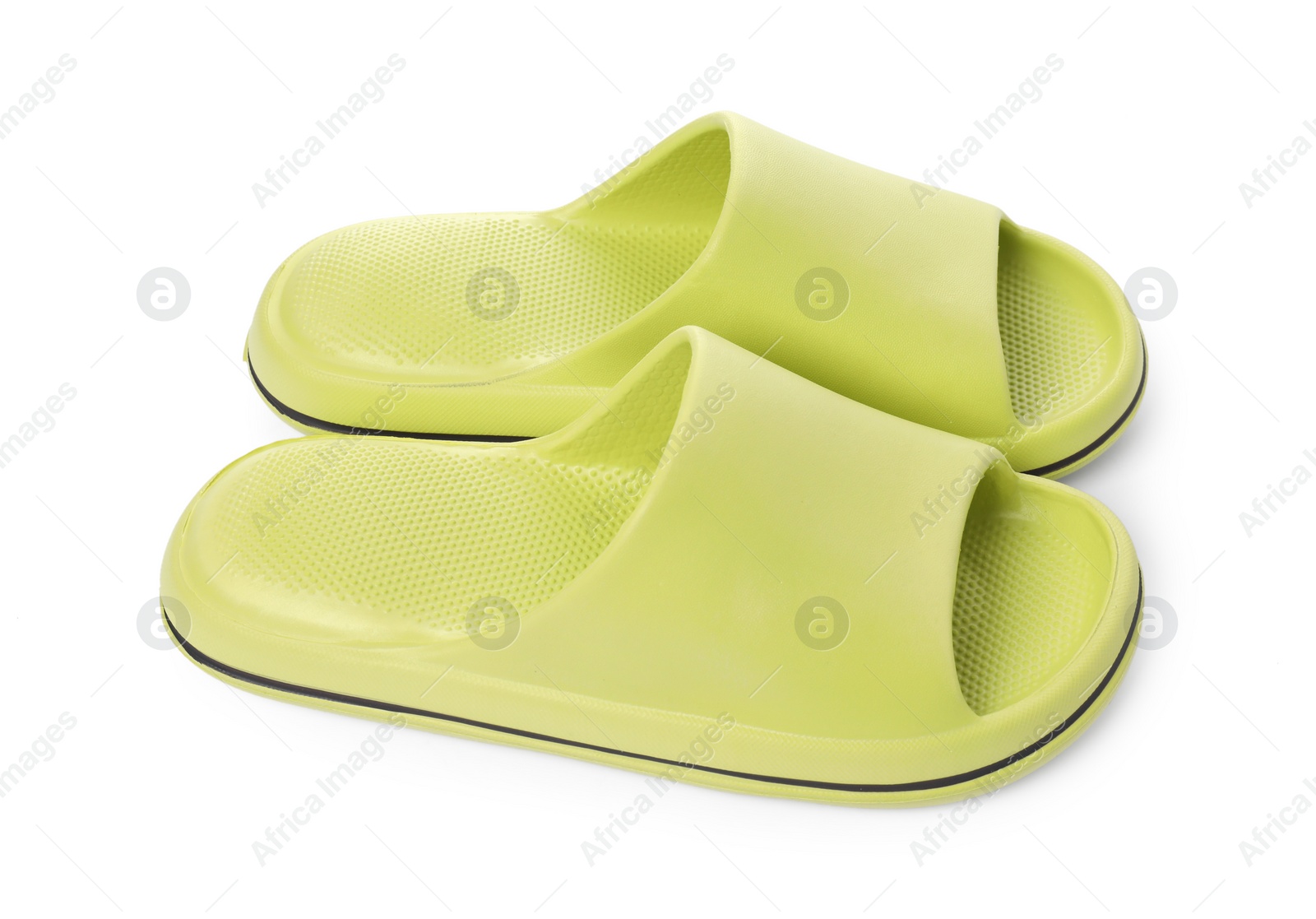 Photo of Pair of green rubber slippers isolated on white