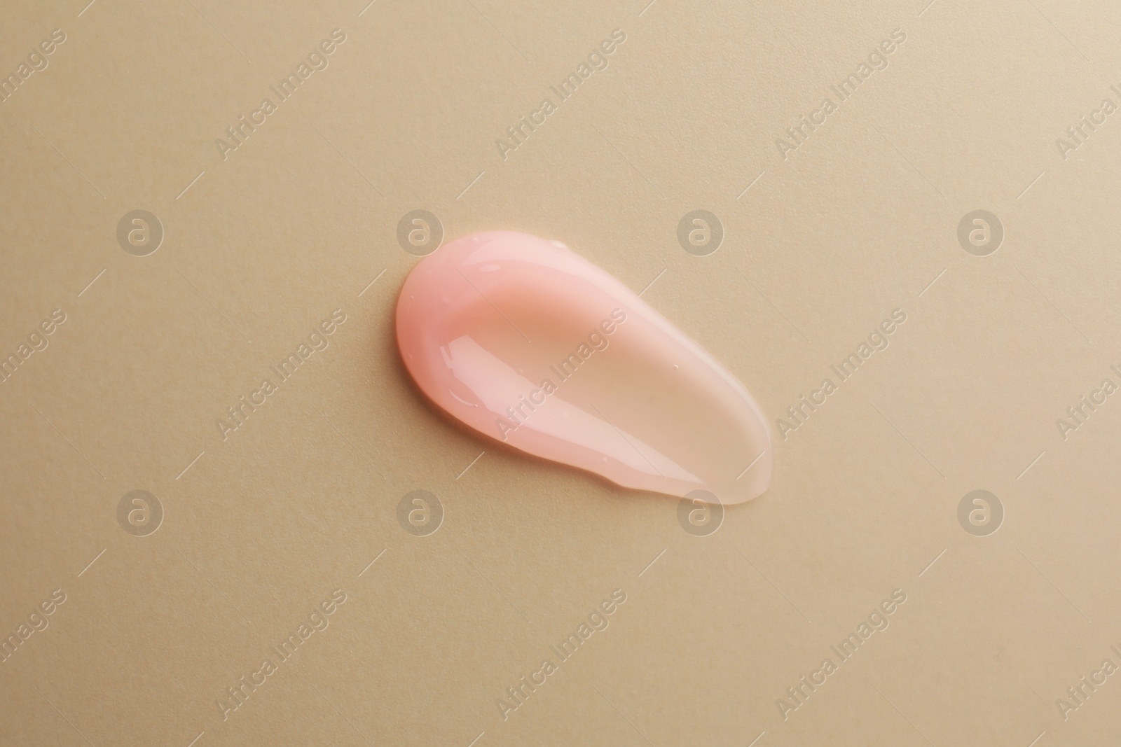 Photo of Sample of cosmetic gel on beige background, top view