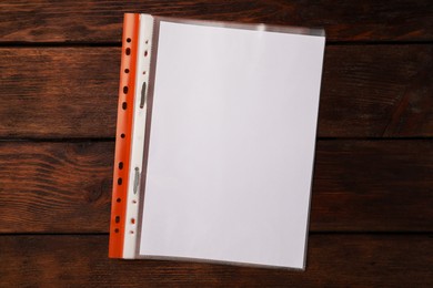 File folder with punched pockets on wooden table, top view. Space for text