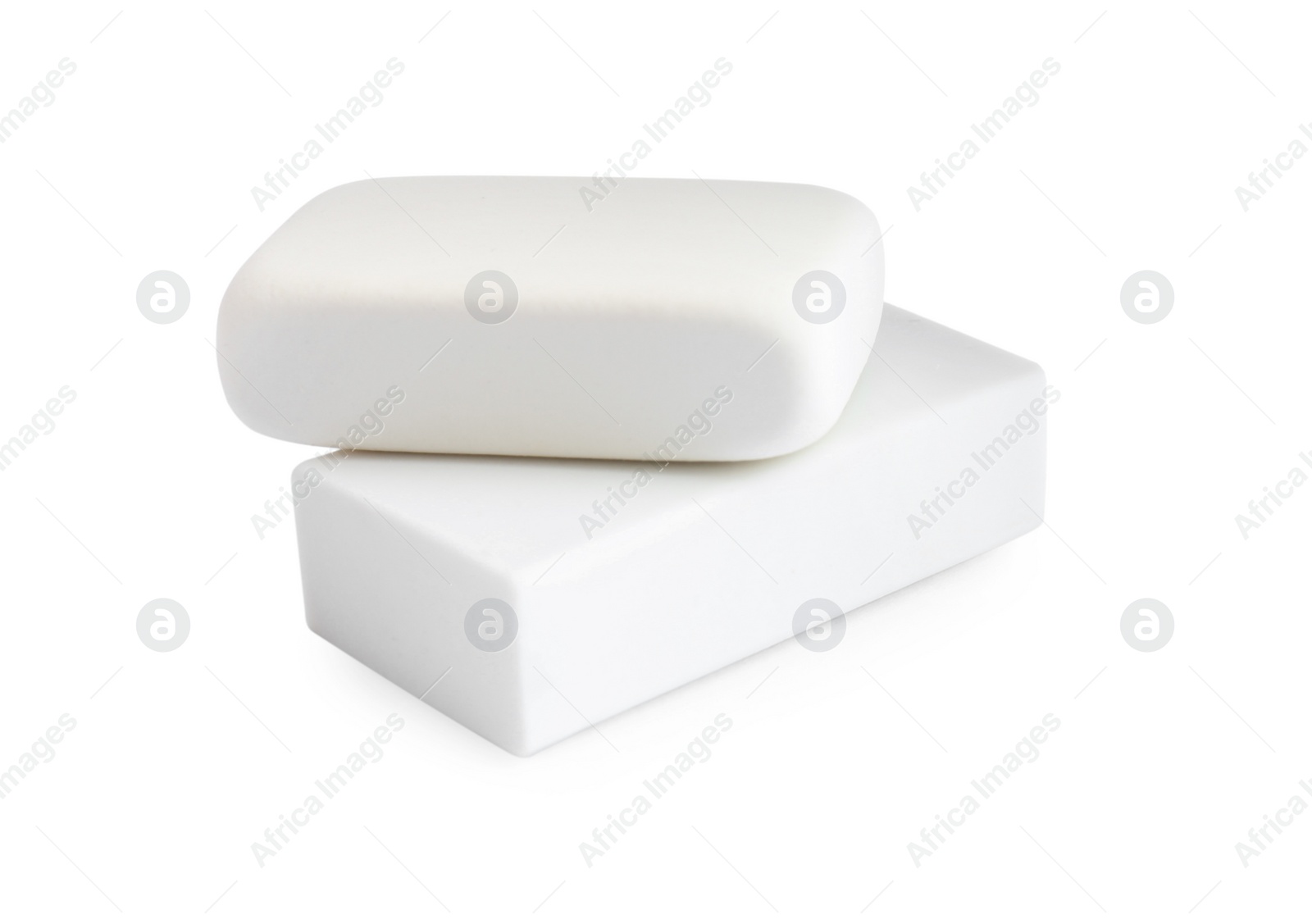 Photo of New erasers isolated on white. School stationery