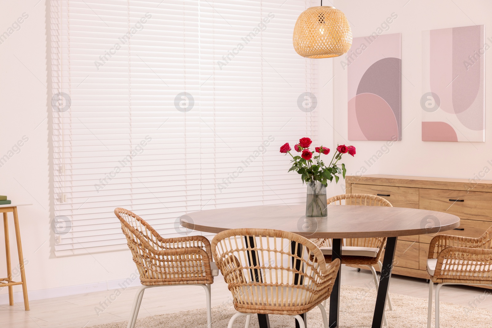 Photo of Stylish dining room interior with comfortable furniture