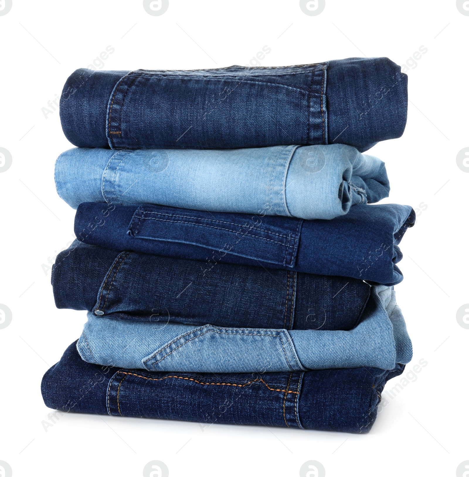 Photo of Stack of different jeans isolated on white