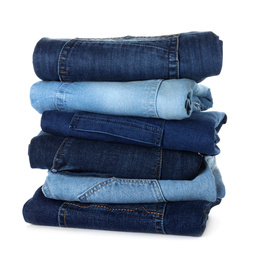 Stack of different jeans isolated on white