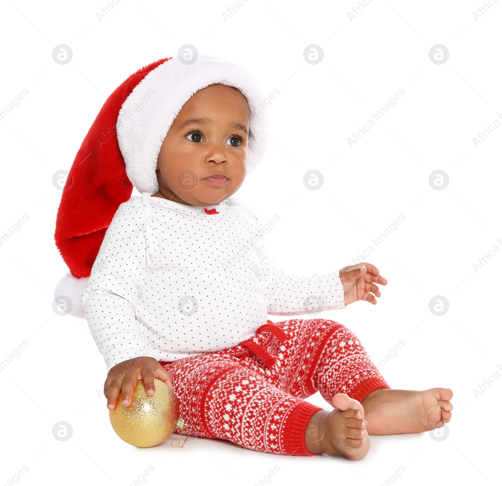 Photo of Festively dressed African-American baby with Christmas decorations on white background