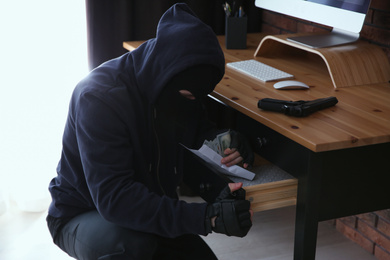 Photo of Dangerous masked criminal stealing money from house