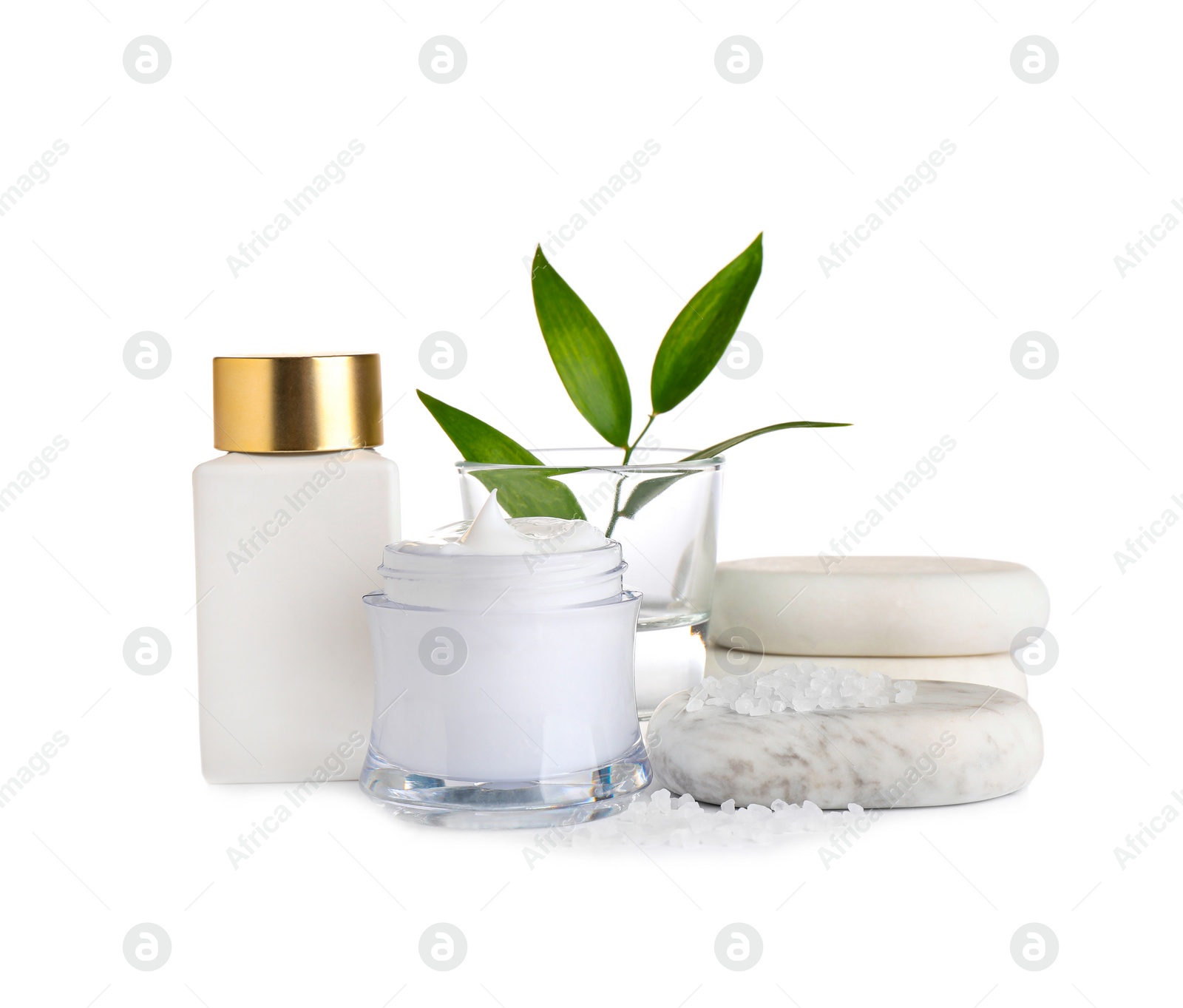 Photo of Composition with cream and spa stones on white background