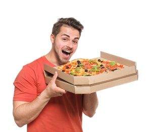 Attractive young man with delicious pizza on white background