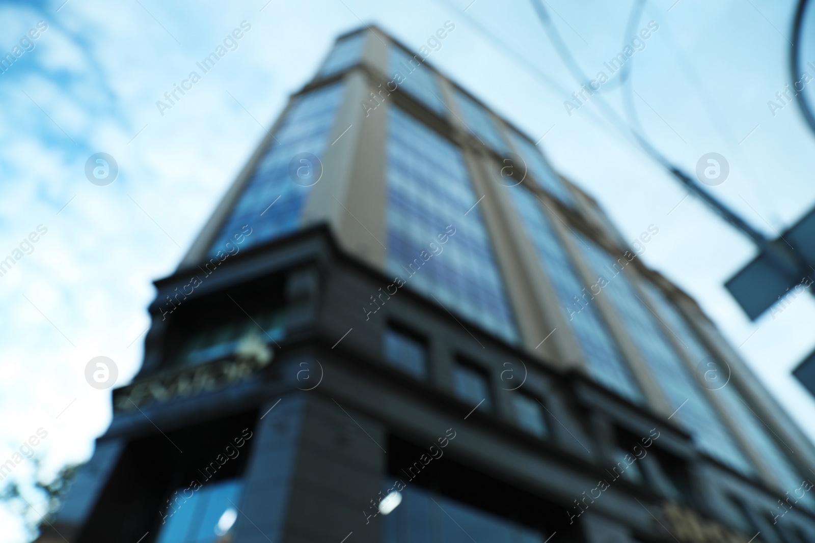 Photo of KYIV, UKRAINE - MAY 23, 2019: Modern business center SENATOR against sky with clouds, bokeh effect