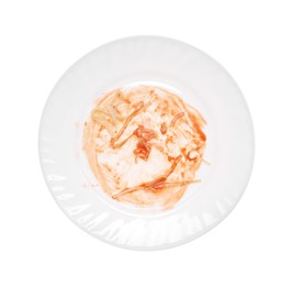 Dirty plate with smeared sauce and pasta on white background, top view
