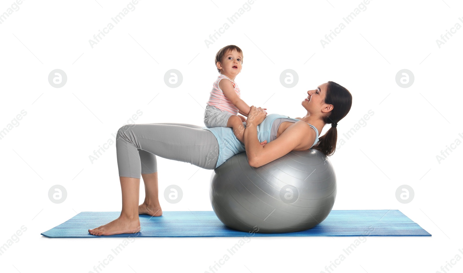 Photo of Young woman doing exercise with her son isolated on white. Time for fitness