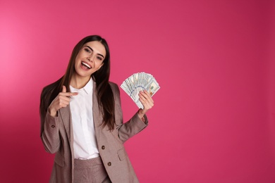 Photo of Businesswoman with money on color background. Space for text