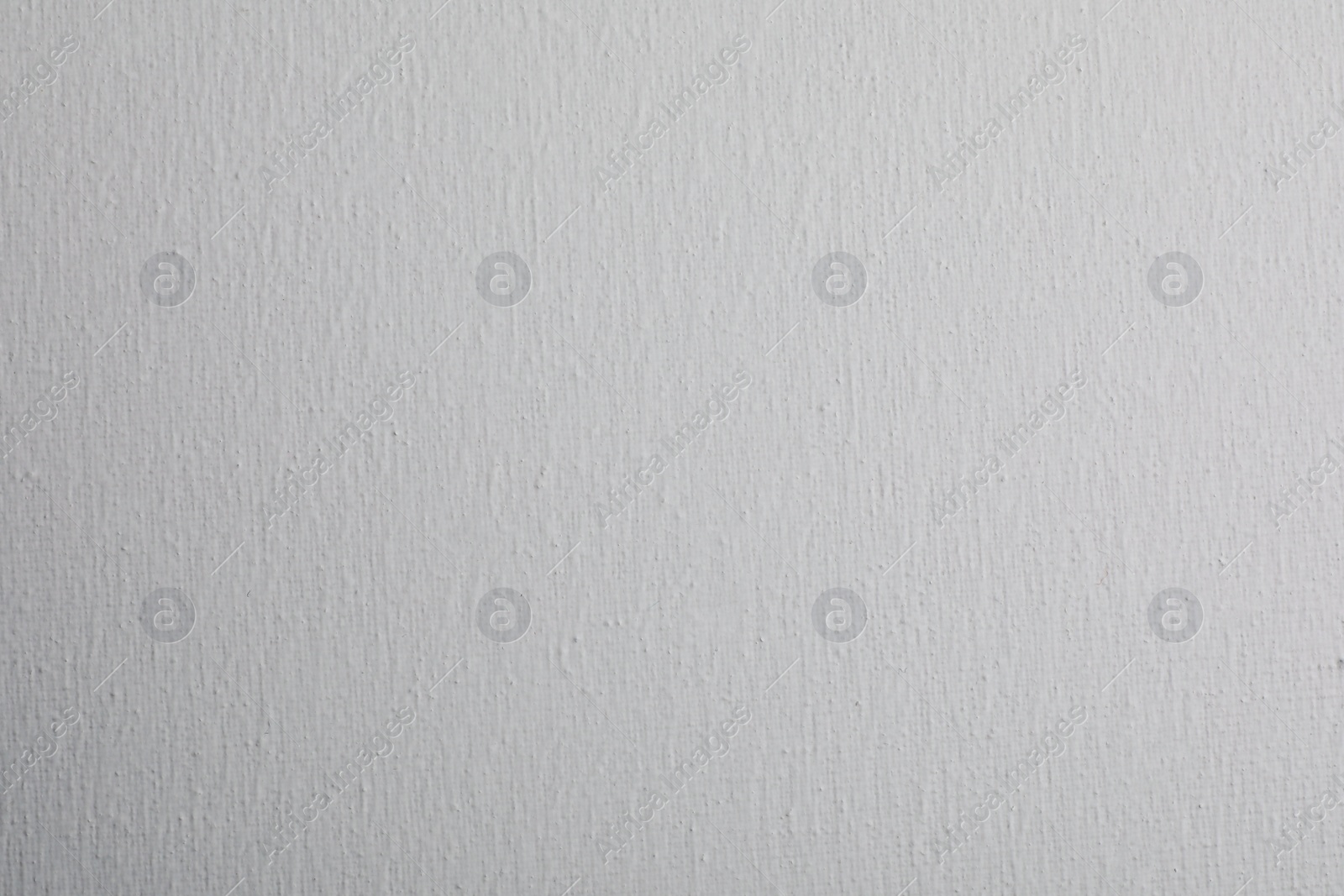 Photo of Blank white canvas as background, closeup view