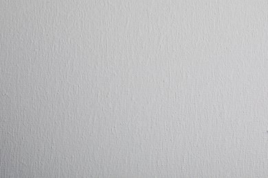 Photo of Blank white canvas as background, closeup view