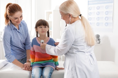 Mother with child visiting doctor in hospital