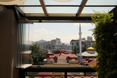 BATUMI, GEORGIA - AUGUST 28, 2022: Cityscape with modern buildings, view from window