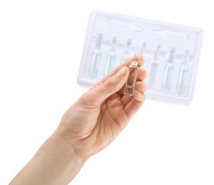 Photo of Woman holding glass ampoule with medication on white background, top view
