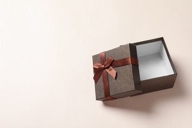 Empty open gift box on light background