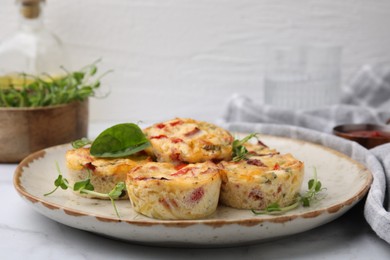 Freshly baked bacon and egg muffins with cheese on table, space for text