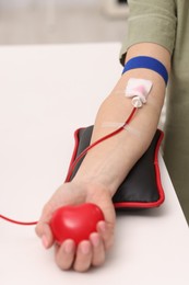 Patient undergoing blood transfusion in hospital, closeup