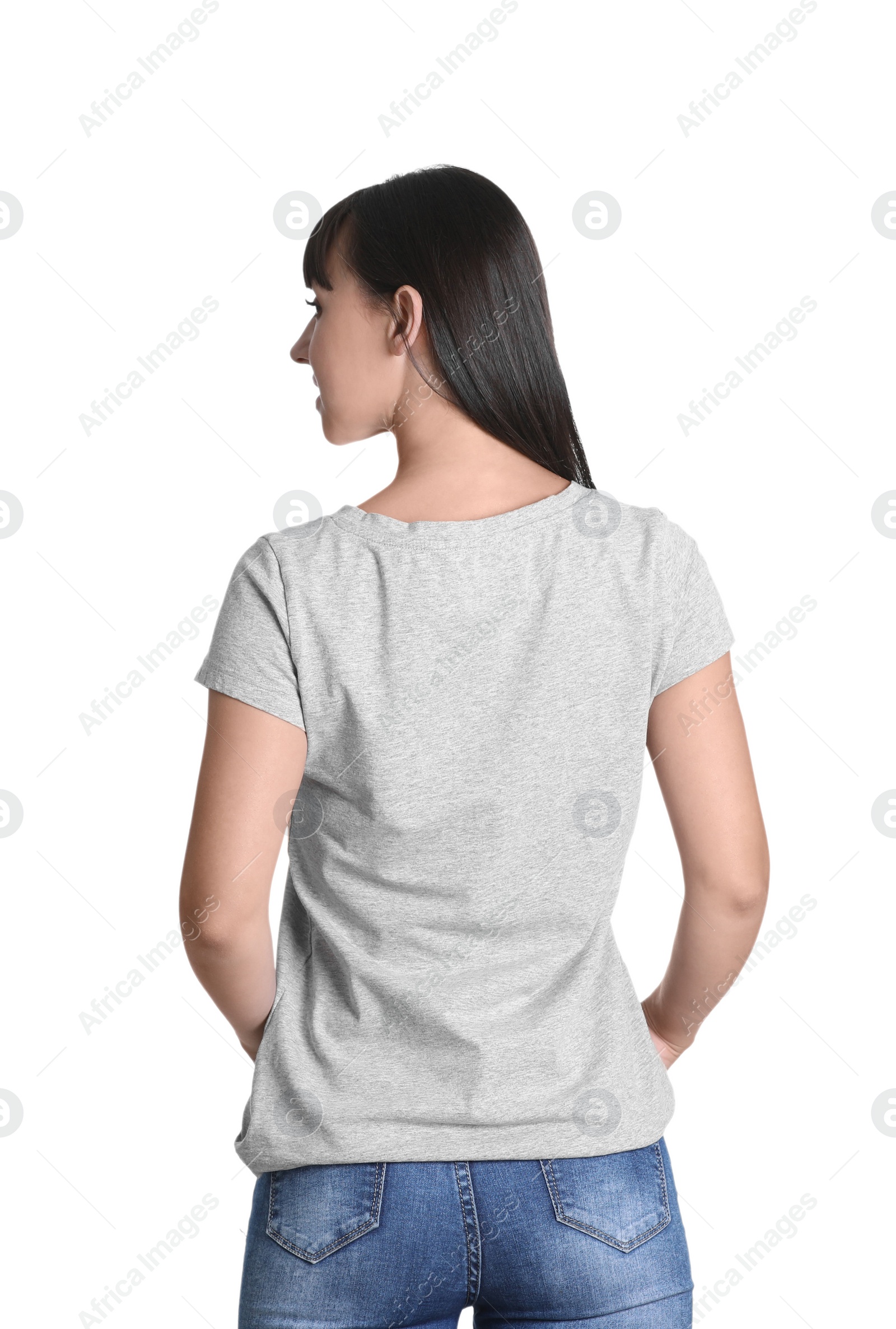 Photo of Young woman in grey t-shirt on white background. Mockup for design