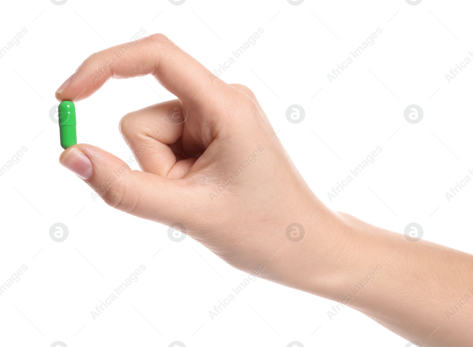 Photo of Woman holding color pill on white background, closeup