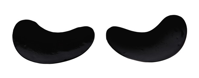 Photo of Black under eye patches on white background, top view. Cosmetic product