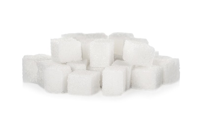 Photo of Heap of refined sugar cubes on white background