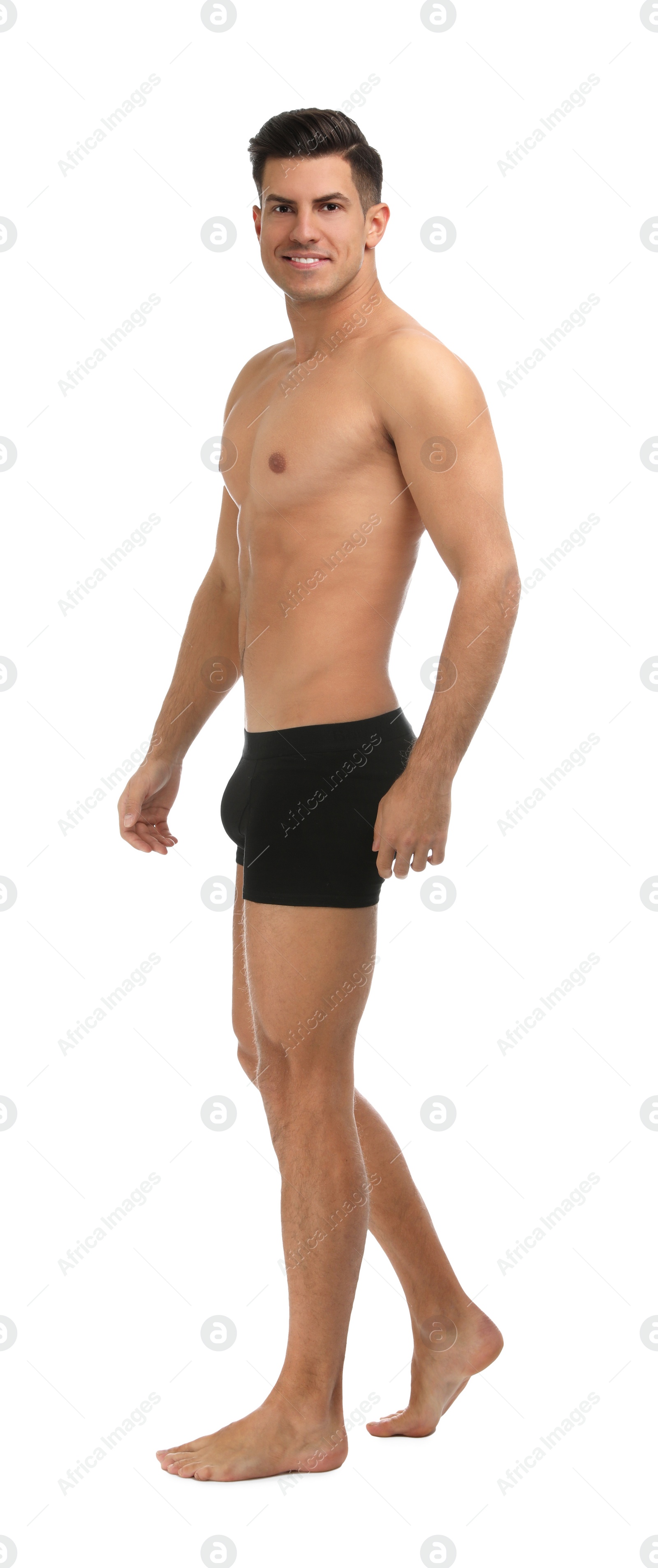 Photo of Handsome man in black underwear on white background