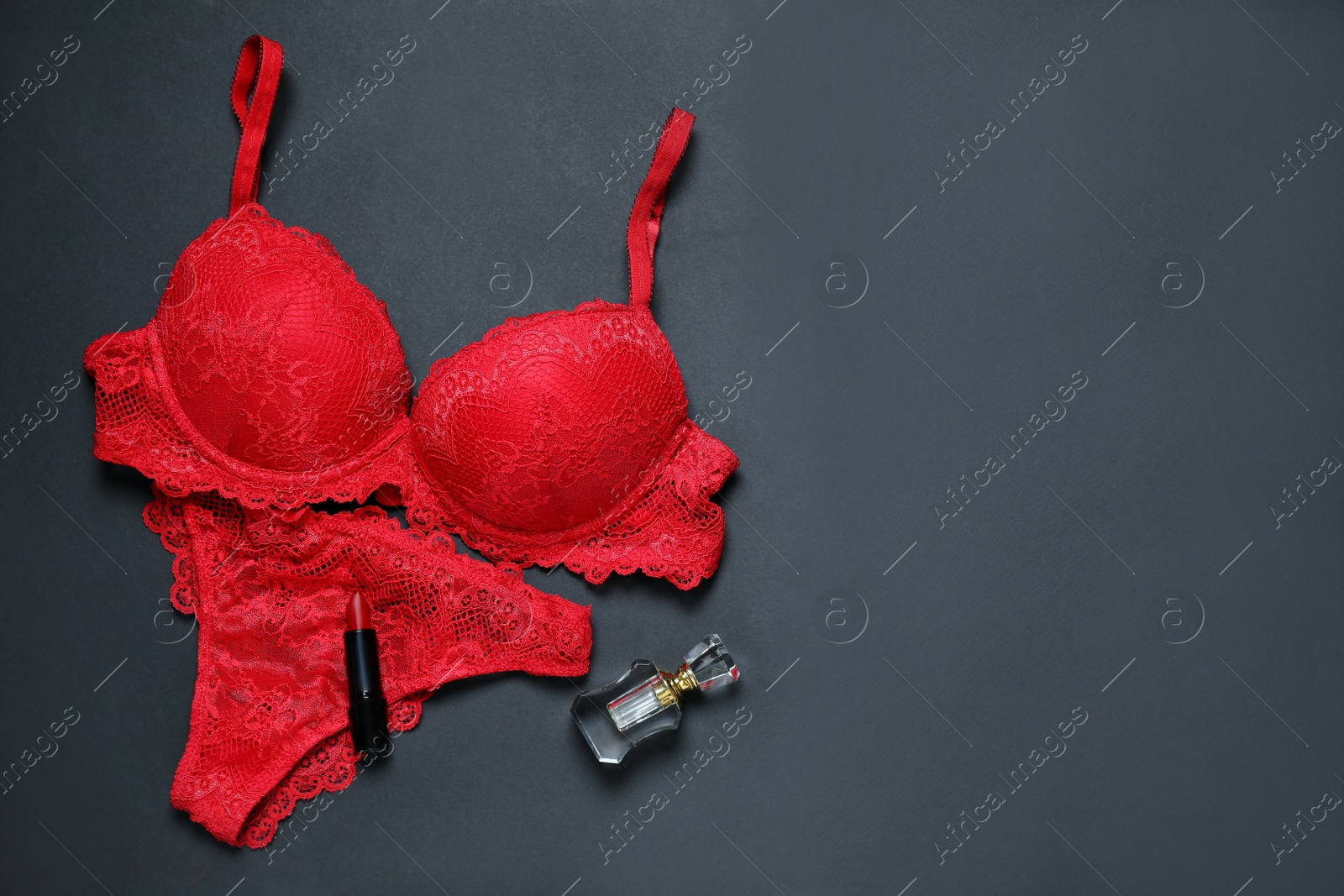 Photo of Composition with elegant women's underwear on black background, flat lay. Space for text