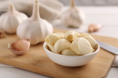 Fresh garlic on white wooden table, closeup