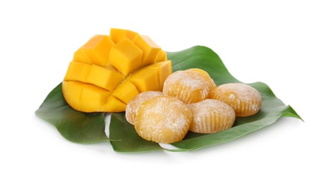 Photo of Delicious mochi with green leaf and mango on white background. Traditional Japanese dessert