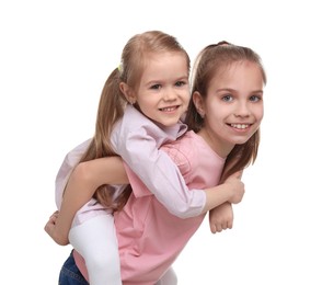 Portrait of cute little sisters on white background