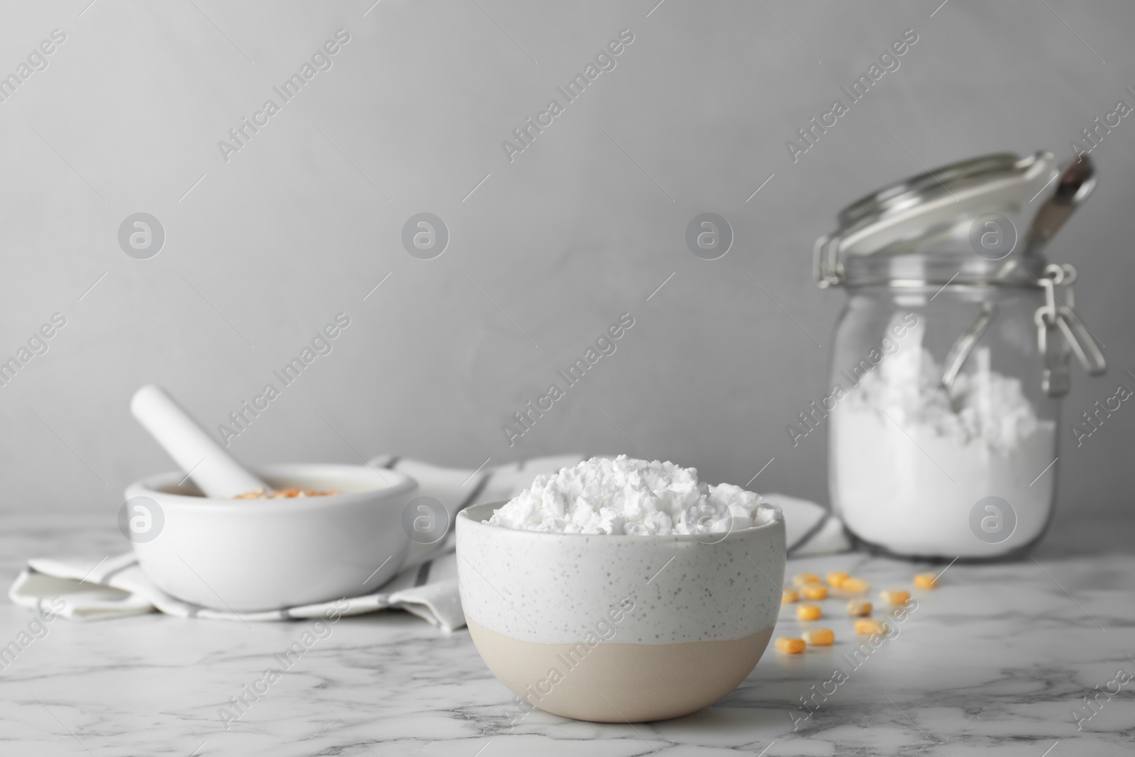 Photo of Bowl with corn starch on marble table