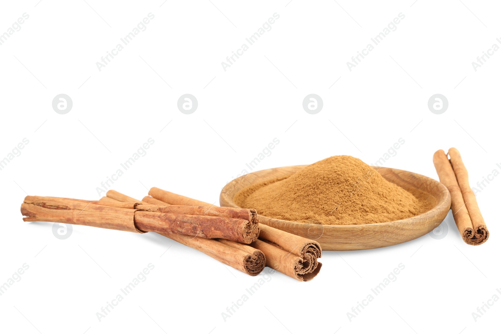 Photo of Dry aromatic cinnamon sticks and powder isolated on white