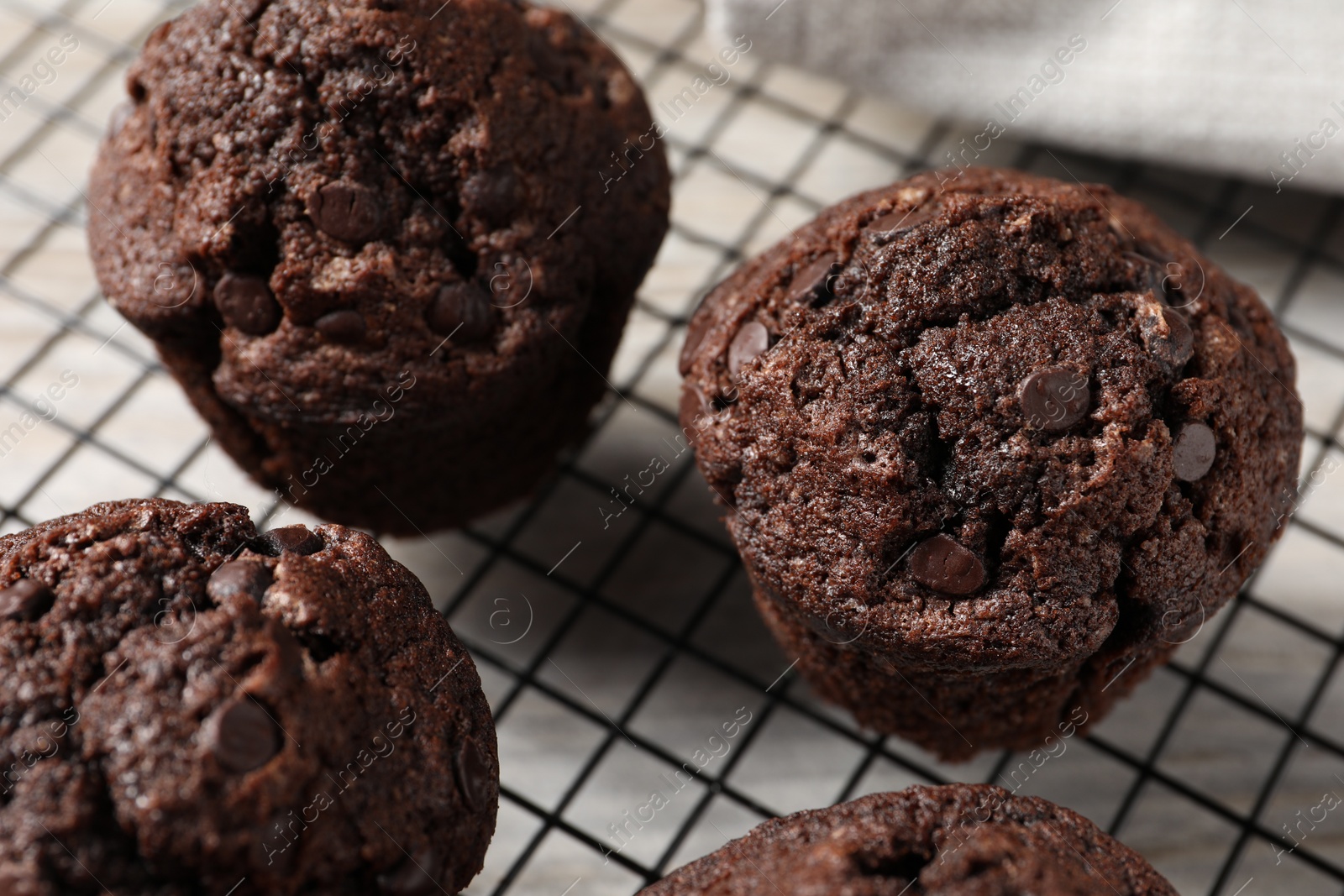 Photo of Delicious chocolate muffins on table, closeup view