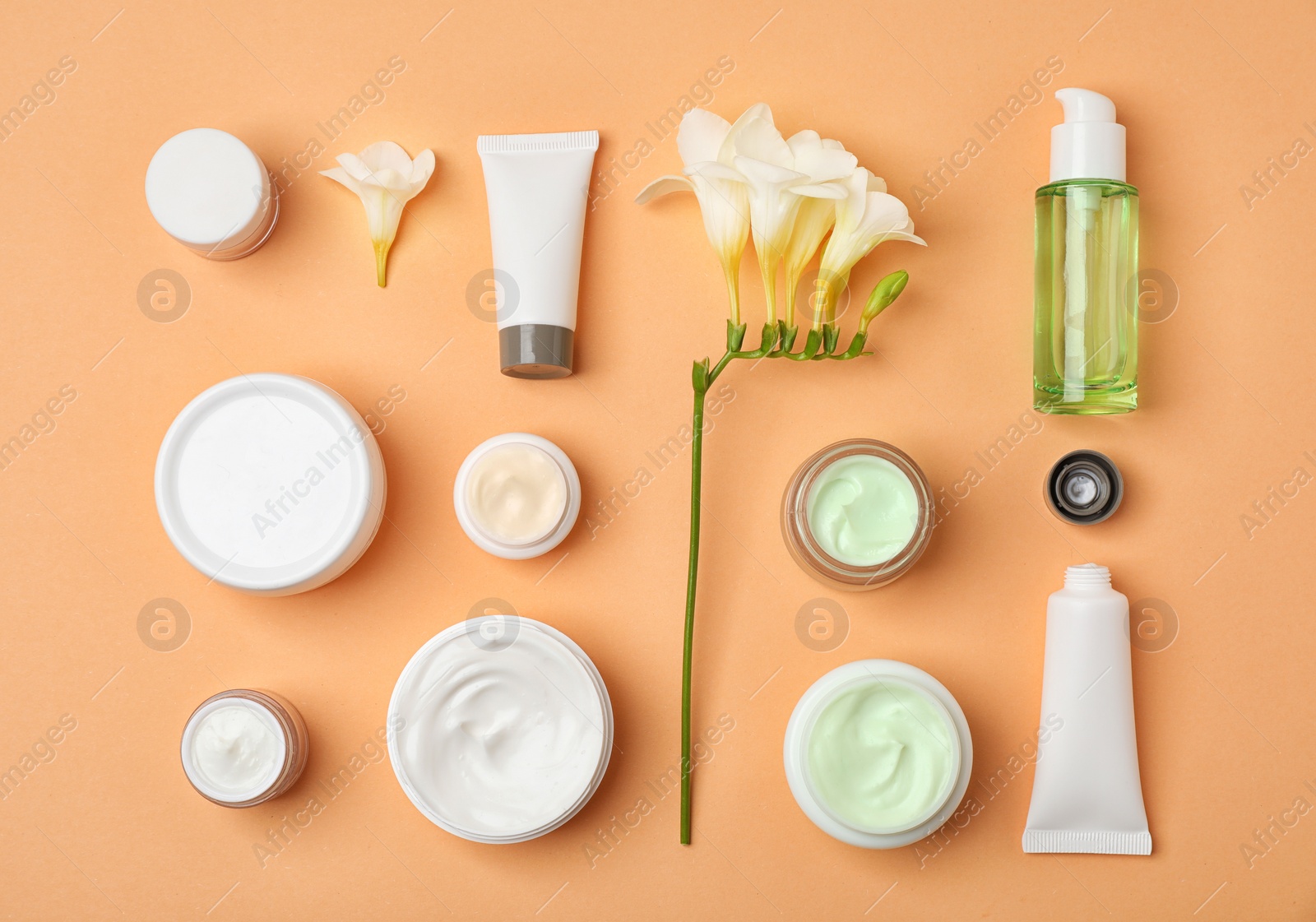 Photo of Flat lay composition with cosmetic products on color background