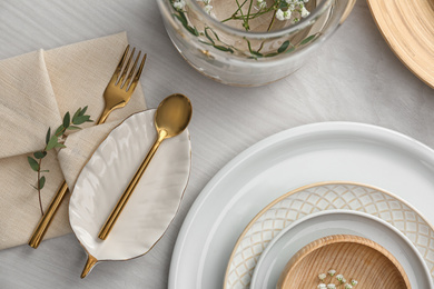 Elegant festive setting on white wooden table, flat lay