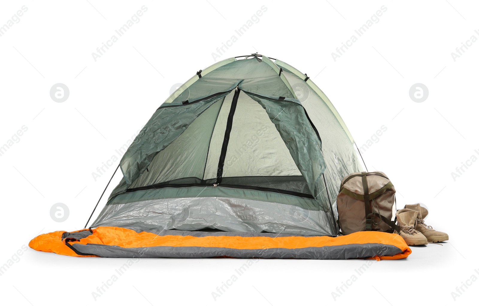 Photo of Comfortable grey camping tent with sleeping bag and boots on white background