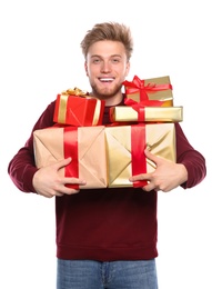 Photo of Young man with Christmas gifts on white background