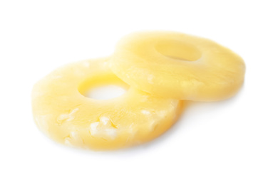 Delicious canned pineapple rings on white background