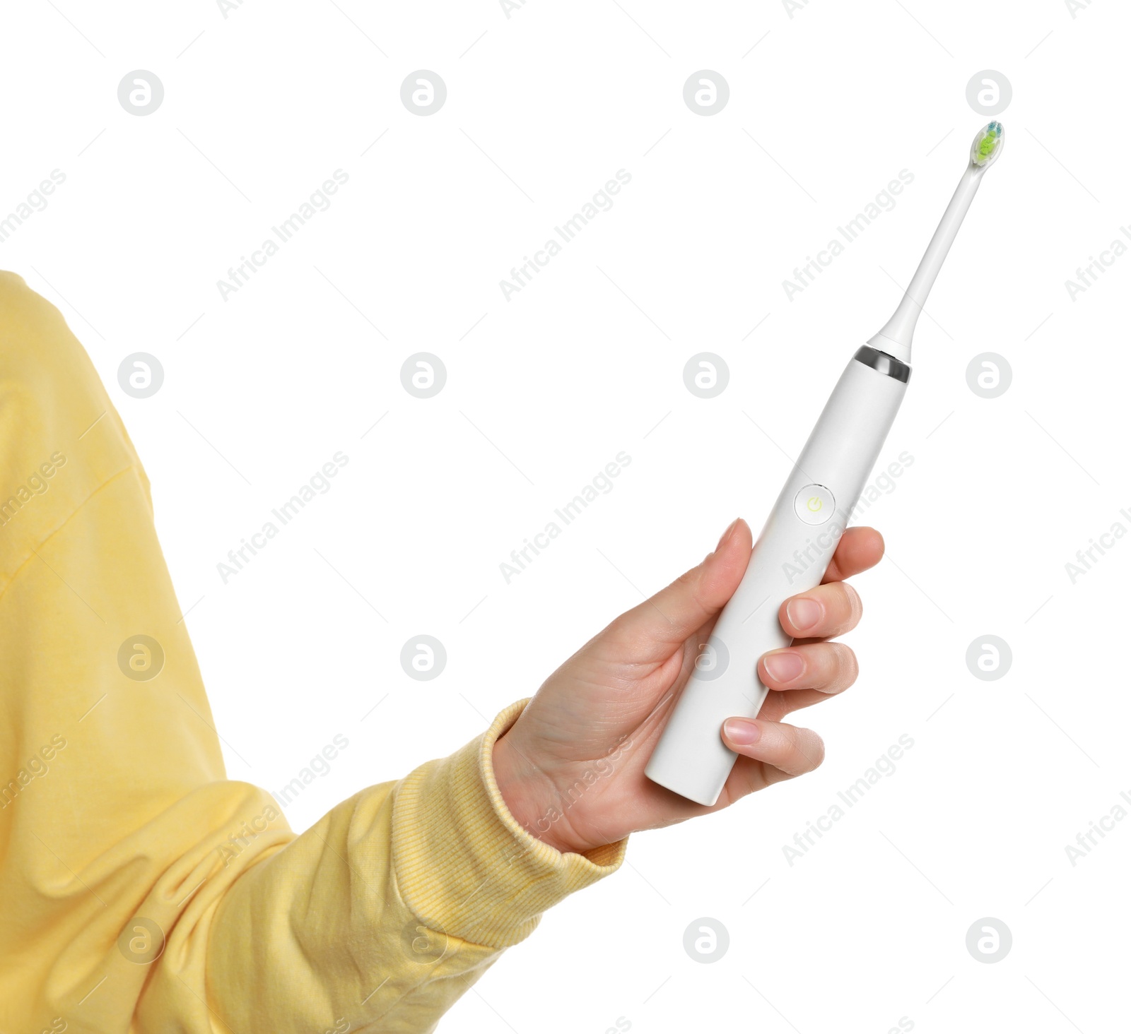 Photo of Woman holding electric toothbrush on white background, closeup