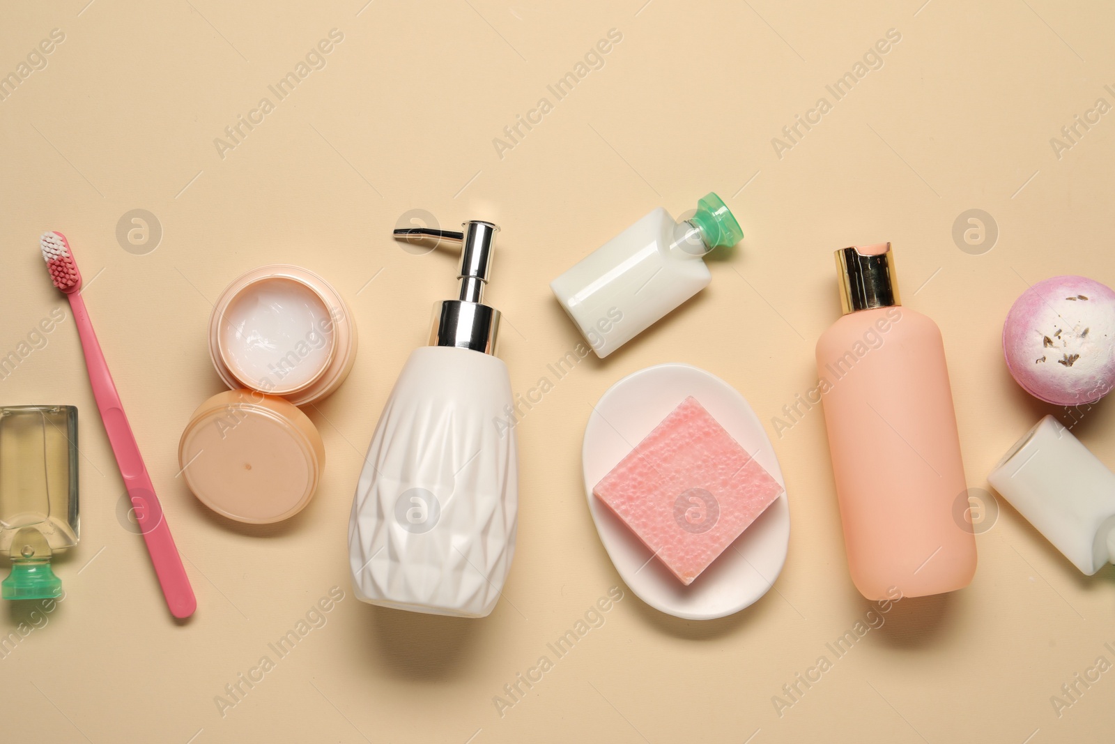 Photo of Bath accessories. Flat lay composition with personal care products on beige background